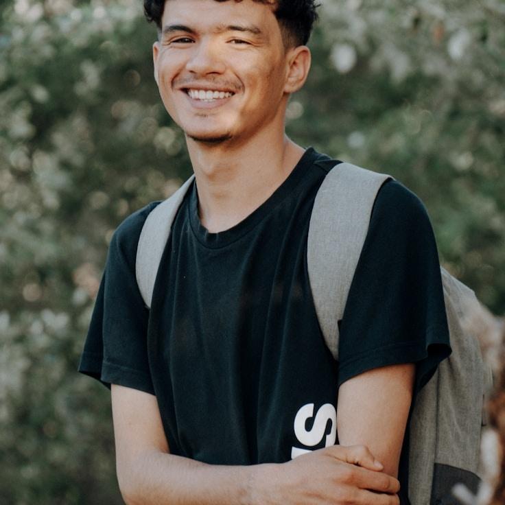 Kaveri Mehta, Lead Design Curator at HarborCrestMuse, reviewing corporate floral arrangements